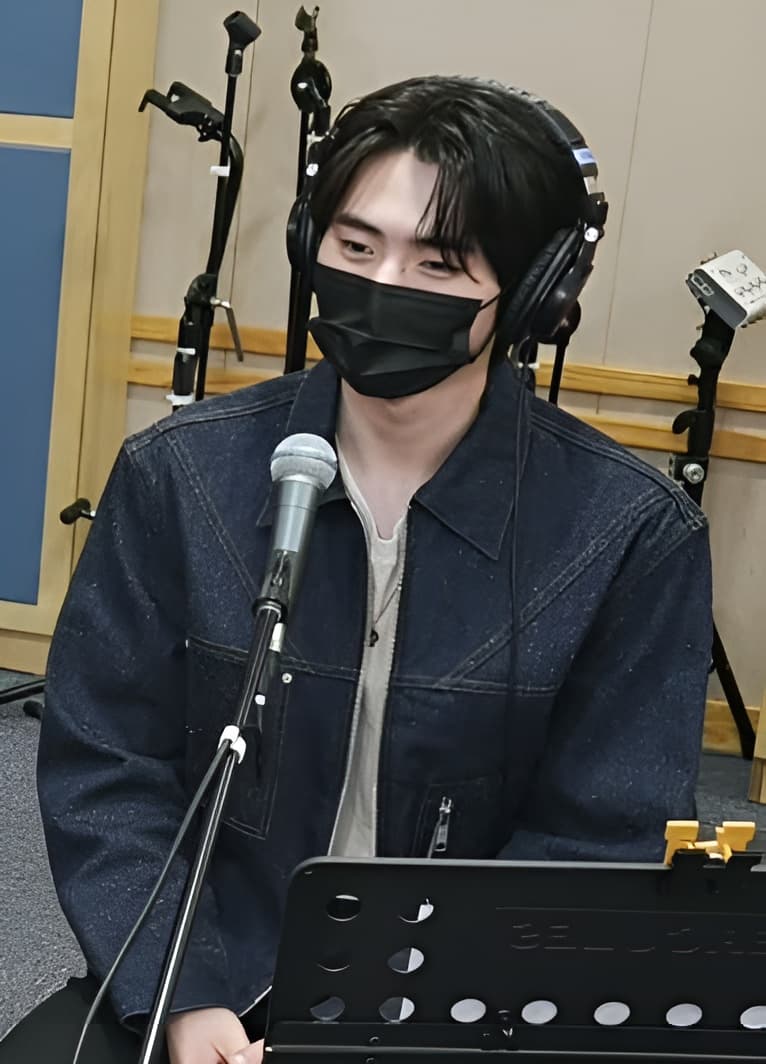 Sunghoon charming smile and graceful posture.